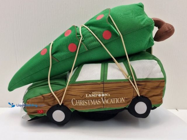 Lot 49-1541761 - (2-Pack) National Lampoon’s Christmas Vacation Animated Plush Clark’s Station Wagon, Model # 21GM196...