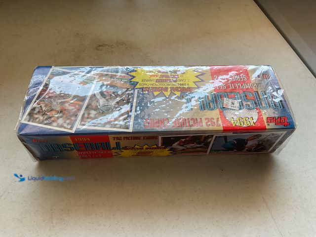 Lot 49-1804639 - FACTORY SEALED 1994 TOPPS BASEBALL CARDS COMPLETE SET