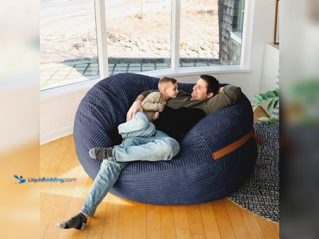Lot 49-2021635 - Giant Blue bean bag Chair With Arms and Pillow. Used.