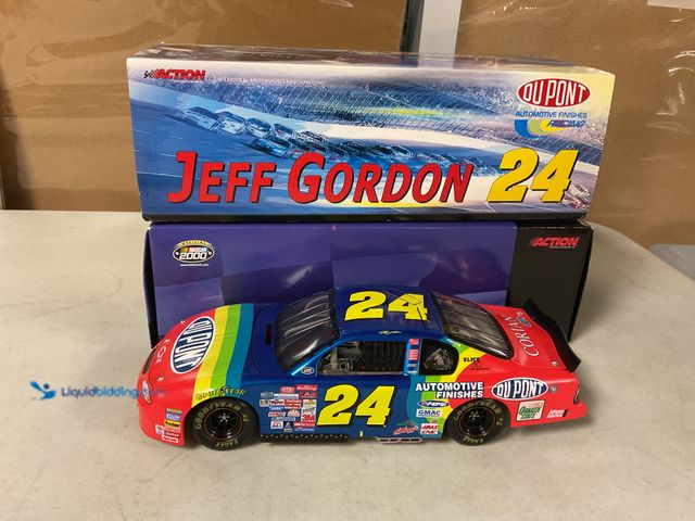 Lot 49-1505616 - COLLECTIBLE ACTION RACING 1/18 SCALE DIECAST CAR IN ORIGINAL BOX #24 JEFF GORDON DUPONT #COINS1211