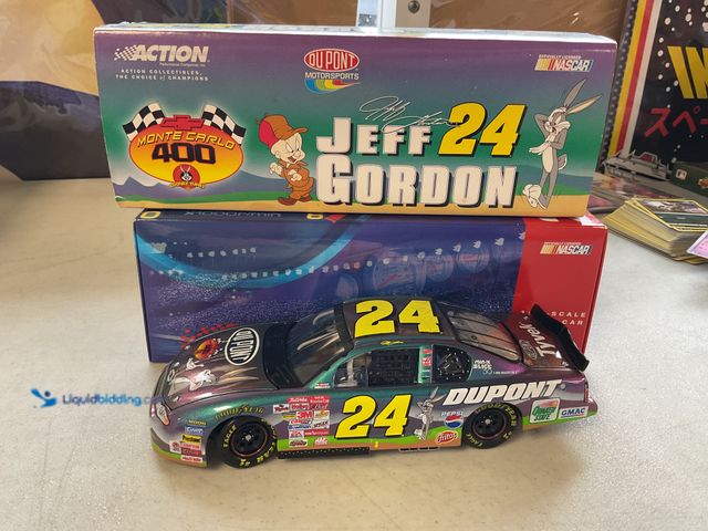 Lot 49-1505304 - COLLECTIBLE ACTION RACING NASCAR JEFF GORDON #24 DUPONT LOONEY TUNES 1/24 SCALE DIECAST CAR IN ORIGI...