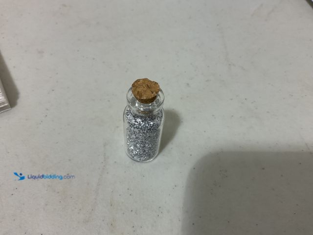 Lot 49-3709165 - RARE ONE INCH GLASS VILE OF PURE SILVER FLAKES