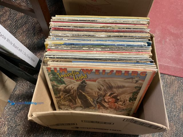 Lot 49-1830542 - COLLECTIBLE LARGE BOX FULL OF PRE-OWNED VINYL RECORDS VARIOUS GENRES AND TITLES INCLUDING BOB SEGER,...