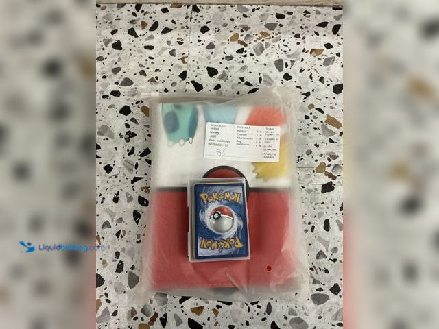 Lot 49-3538924 - Osznmmg trading card binder Pokemon. Comes with mystery assorted Pokemon cards.