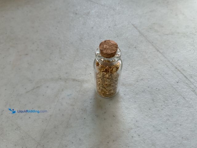 Lot 49-5350451 - RARE ONE INCH GLASS VILE OF PURE 24K GOLD FLAKES