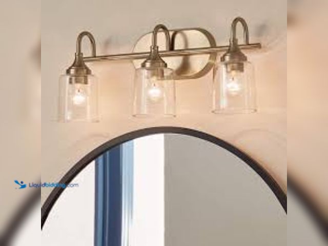 Lot 49-5459866 - KICHLER Erta 24 in. 3-Light Champagne Bronze Bathroom Vanity Light with Clear Glass Shades. Model # ...