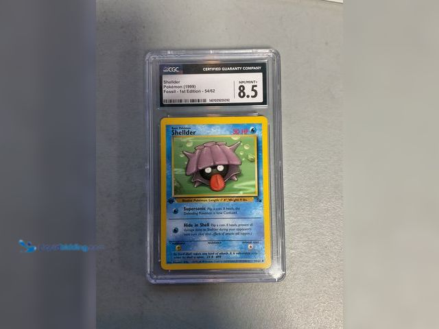 Lot 49-1830591 - COLLECTIBLE WOW! GRADED CARD 1999 POKÉMON FOSSIL SHELDER 54/62 CGC 8.5. NM/MINT+ AMAZING GRADED CARD...