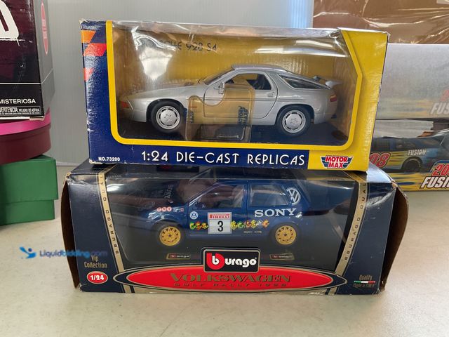 Lot 49-1505053 - COLLECTIBLE LOT OF 2 1/24 SCALE DIECAST CARS IN ORIGINAL BOXES INCLUDING BURAGO VOLKSWAGEN GOLF RALL...