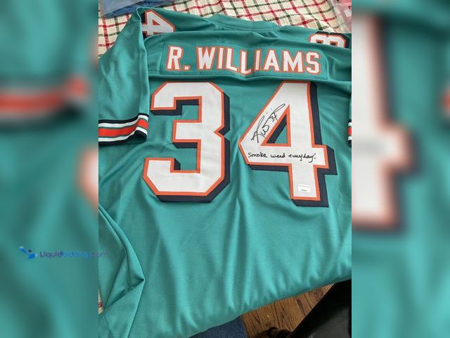 Lot 49-1505908 - COLLECTIBLE VERY NICE MIAMI DOLPHINS RICKY WILLIAMS STITCHED FOOTBALL JERSEY WITH “SMOKE WEED EVERYD...