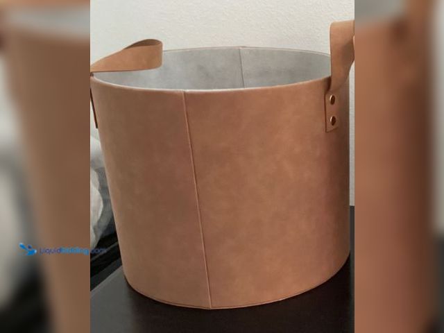 Lot 49-2020772 - Faux Leather Round Storage Bin Camel Brown, W/handles Model # 267685829641. MSRP: $33.00. Unused.  R...