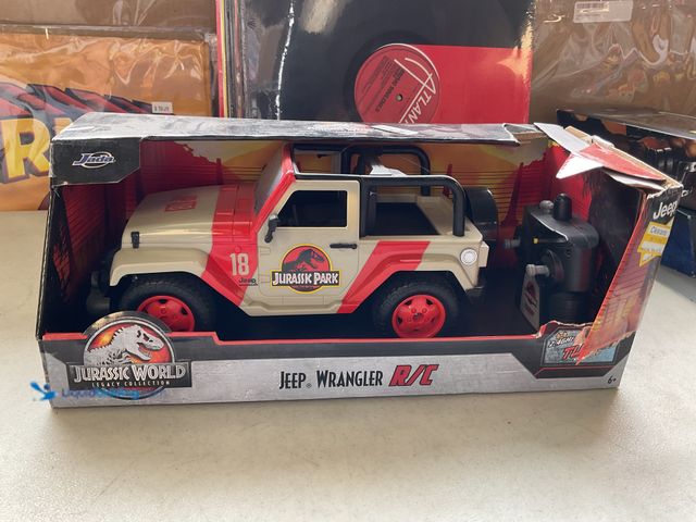 Lot 49-1830752 - COLLECTIBLE JADA JURASSIC WORLD LEGACY COLLECTION “JEEP WRANGLER R/C CAR IN ORIGINAL BOX #COINS0219