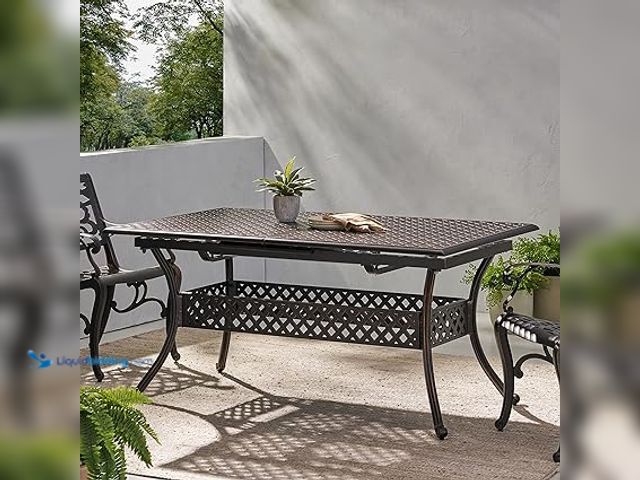 Lot 49-5433610 - ABIGAIL CAST Black Aluminum Rectangle Outdoor Dining Table with Extension. Item is Unused
