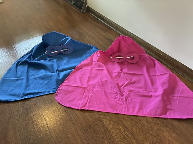 Lot 499-431 - 2 Superhero capes and masks. Made and donated by Bev Barnhill.