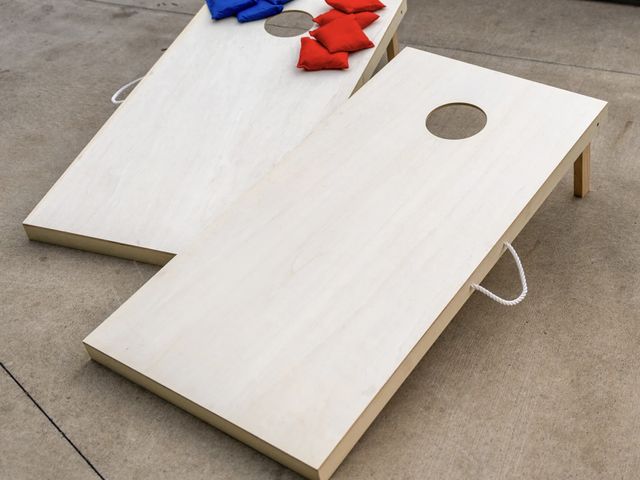 Lot 499-050 - New TRIUMPH- 2X4 CORNHOLE GAME 

INCLUDES - Two 48" L x 24" W x 2" H tournament boards with eight 6"...