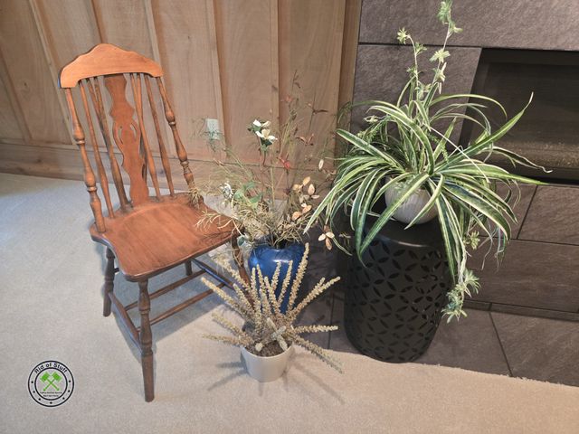 Lot 53-602 - Antique Wooden chair with several Faux house plants and metal plant stand
