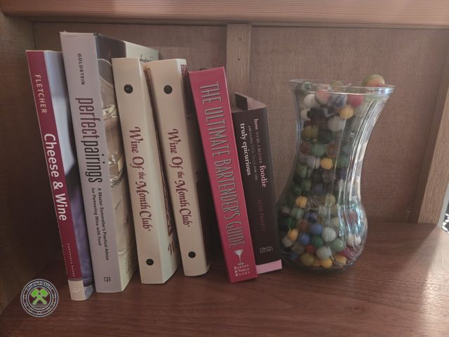 Lot 53-579 - Jar filled with Marbles and Misc books