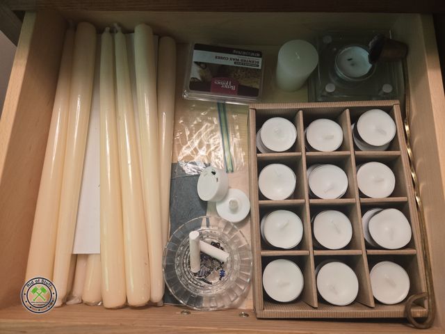 Lot 53-549 - Drawer of tea light candles, Stick candles, scent warmers, and more.