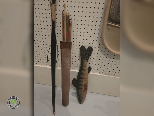 Lot 53-636 - Recurved Bow, arrows and wooden fish wall art