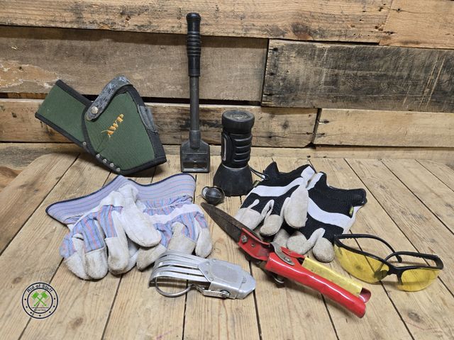 Lot 53-1015 - 2 pairs of work gloves, flashlight, tools, and gun holster