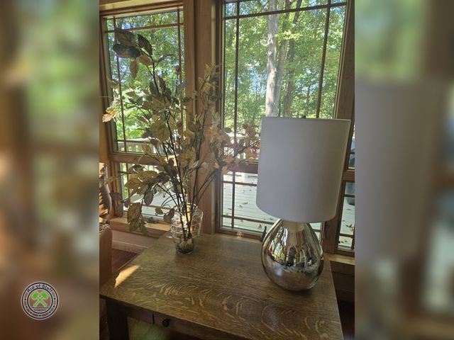 Lot 53-527 - Silver Colored Lamp with Shade and unique clear vase with artificial plant