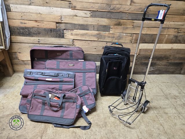 Lot 53-833 - Complete Set of Purple American Tourister Luggage. Rolling Metal Luggage Cart and other Black Rollin...