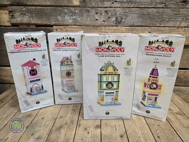 Lot 53-3106 - (4) New in the box Dept 56 Monopoly Buildings