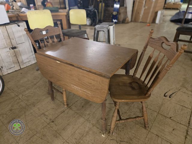 Lot 53-951 - Drop Leaf Wooden Table with 2 Solid Wooden Chairs