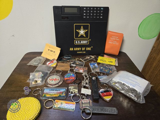 Lot 53-734 - Large lot of Misc Keychains, vintage coin purse, US army Calculator, Emergency Kit and more (BSMT-3)