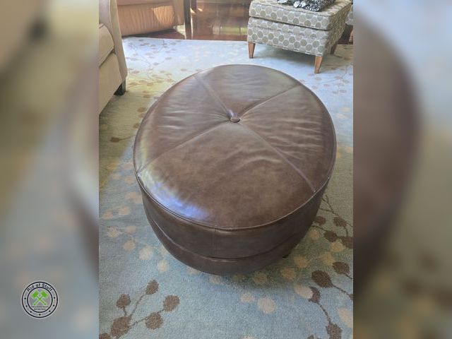 Lot 53-522 - Large Oval Brown Leather Style Ottoman - Measures: 43"x30"x16" - Great condition - No Rips/Tears
