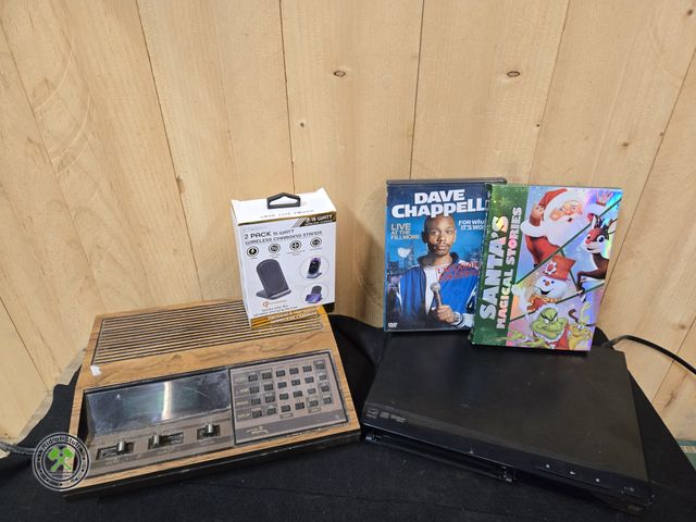 Lot 53-557 - Vintage Regency z30 radio receiver, DVD Player, DVD's and Wireless Charging Stands (B5B)