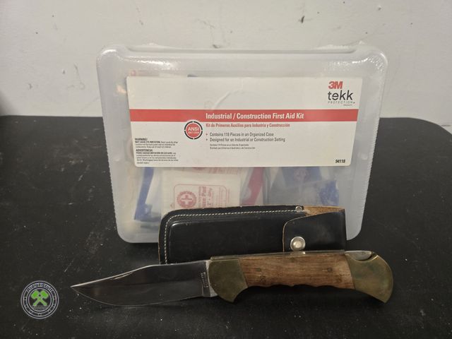 Lot 53-648 - Large Pocket Knife with Sheath and New First Aid Kit (BSMT)