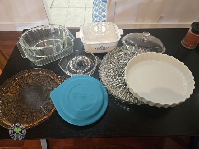 Lot 53-563 - Corning Casserole Dish with Lid, Glass Serving Platters, Glass Pyrex Pans, glass hand juicer and mor...