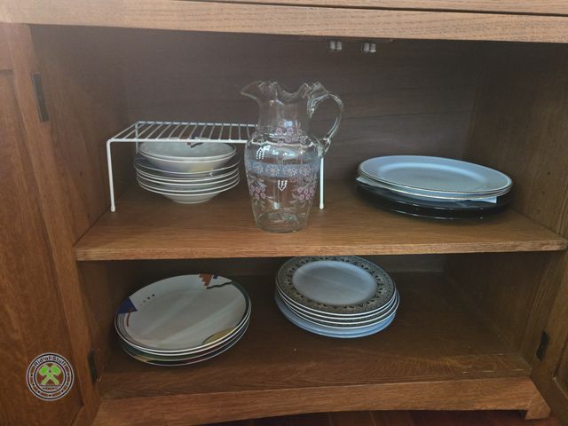 Lot 53-551 - Contents of Cabinet - Includes: Dinner Plates, Vintage Glass Pitcher, Wire Rack and more - Bring Box...