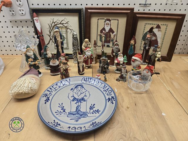 Lot 53-618 - Large lot of Collectible Santa Claus Figurines with Plastic Storage Tote