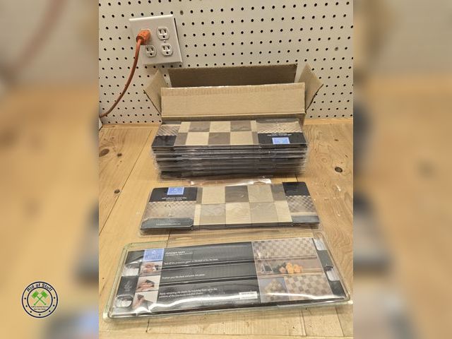Lot 53-637 - 8 Packages of Champagne Square Peel and Stick Backsplash Tiles