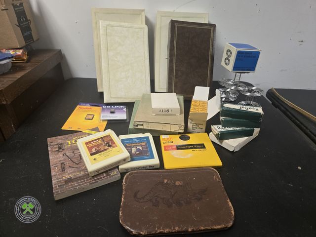 Lot 53-641 - Lot of Misc Vintage Items - 8 Track Cassettes, Photo Albums, Vintage Kodak Camera Accessories, New I...