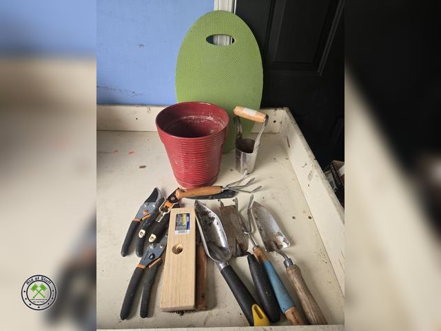 Lot 53-620 - Planting Pot filled with gardening hand tools, foam knee pad and more