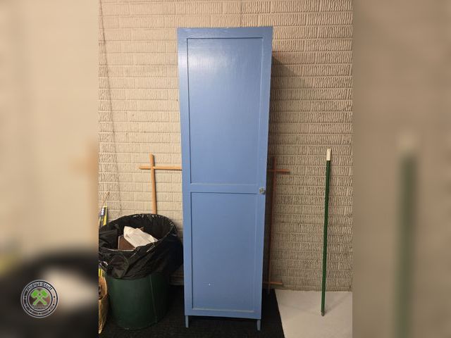 Lot 53-630 - Blue Wooden Storage Cabinet - Measures: 19"x13"x72" - Buyer must bring help to load. Cabinet is not ...