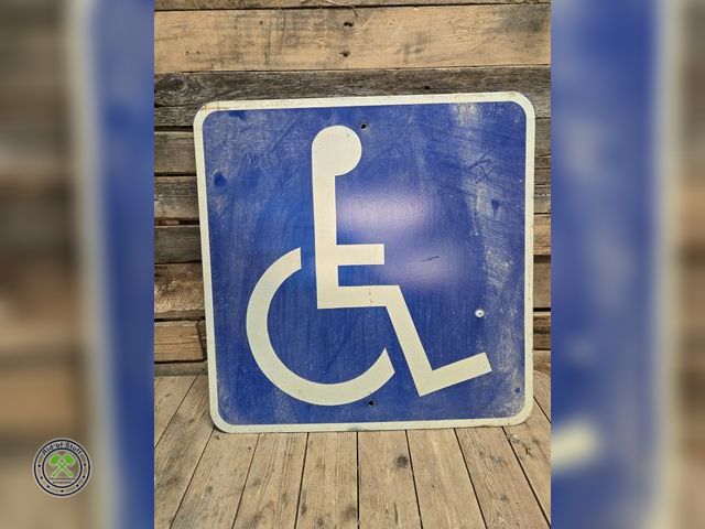Lot 53-1087 - Large Metal Retired Transportation Road Handicapped Sign - Measures: 24"x24"