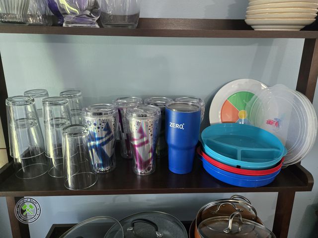 Lot 53-547 - Beverage Cups with Lids-some are coca cola, Plastic Divided Plates with storage lids, Clear Glass Dr...