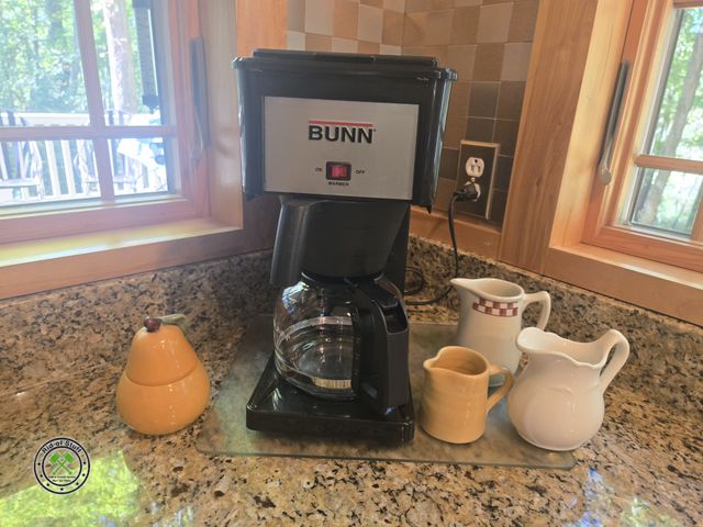 Lot 53-543 - Bunn 10 Cup Coffee Maker with Misc pitchers and candle