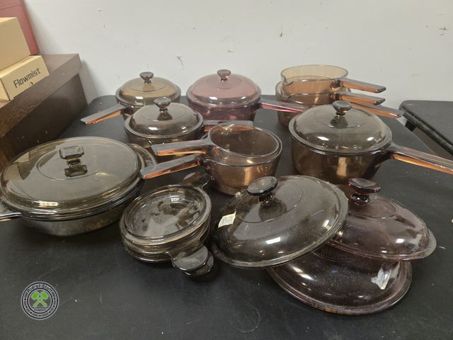 Lot 53-668 - Large Lot of Colored Glass Anchor Hocking/Corning Ware pots/pans/dishes with lids - brown and purple...
