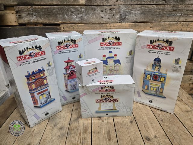 Lot 53-3107 - Lot of (4) New Dept 56 Monopoly Buildings with Monopoly City Lights Lighted Sign