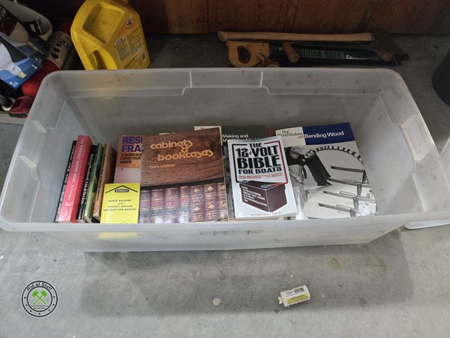 Lot 53-754 - Tote full of Woodworking, Cabinet making, Boat Bible, and more how to books.