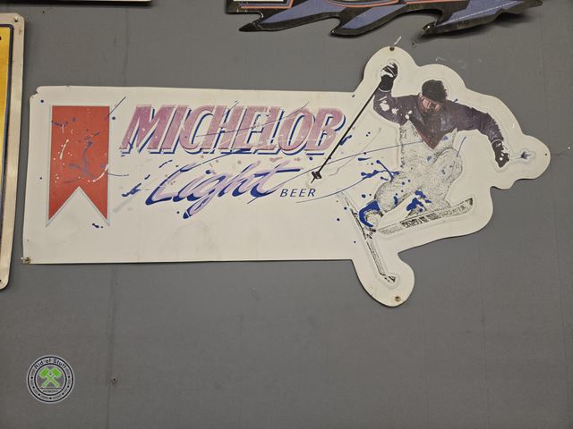 Lot 53-577 - Metal Beer Michelob Light Beer Winter Skiing Wall Decor -Measures: 35"x18"