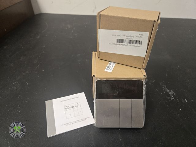 Lot 53-643 - (2) New Stainless Black Programmable Thermostats (BSMT)