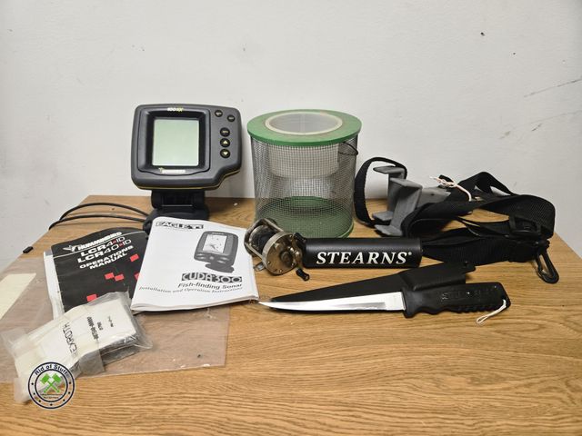 Lot 53-756 - Hummingbird Fish Finder with booklet, fishing reel, filet knife, Cricket keeper, and more (BSMT)
