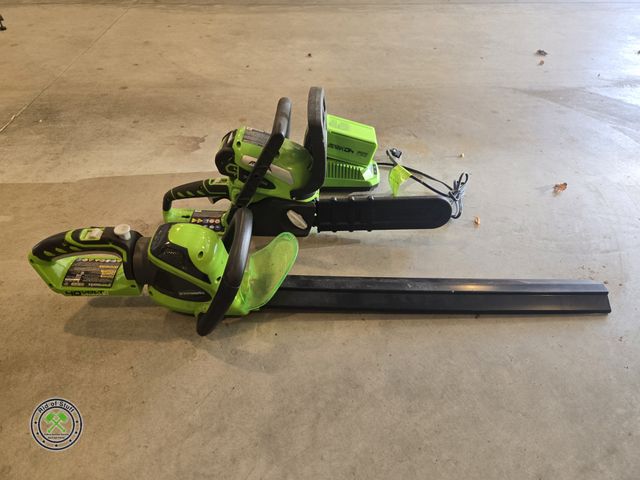 Lot 53-676 - Battery Powered 40Volt Battery Operated Chainsaw and Blower - Comes with 1 Battery and 1 Charger - B...
