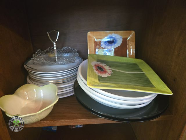 Lot 53-552 - Contents of cabinet - Includes: Plates, Decorative bowls, Collectible glass and more - Bring box to ...