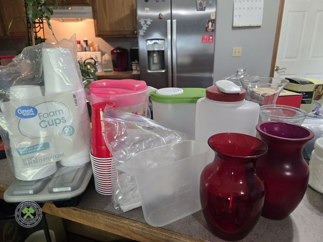 Lot 53-531 - Lot of Plastic Disposable Cups, Glass Vases, Pitchers Plastic Spoons and more